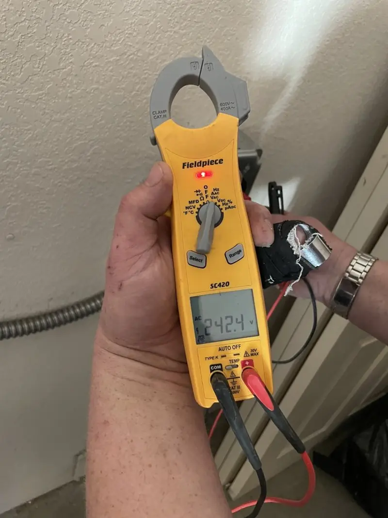 Voltage testing with clamp meter during Hot Tub / Pool Electrical Wiring in Manchester